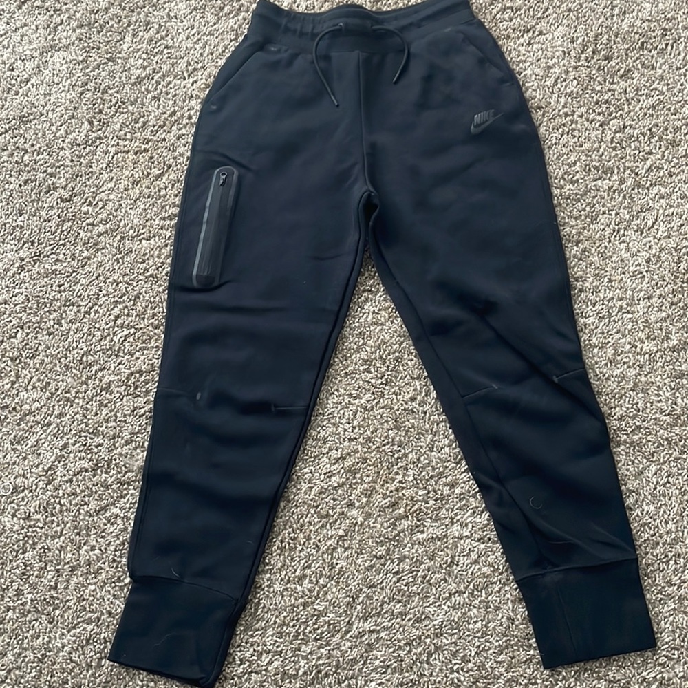 Black Nike tech pants